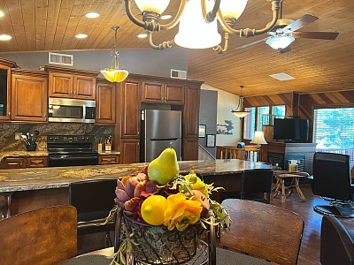Kitchen table seats 6, breakfast bar seats 4, dinnerware.
