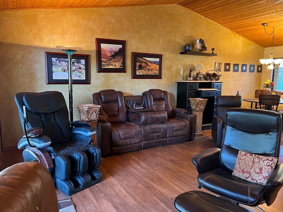 Family room seats 6 comfortably including a massage chair.