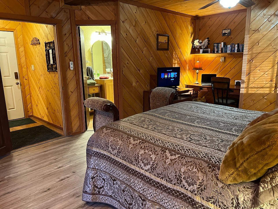 Downstairs master suite has a desk with monitor.